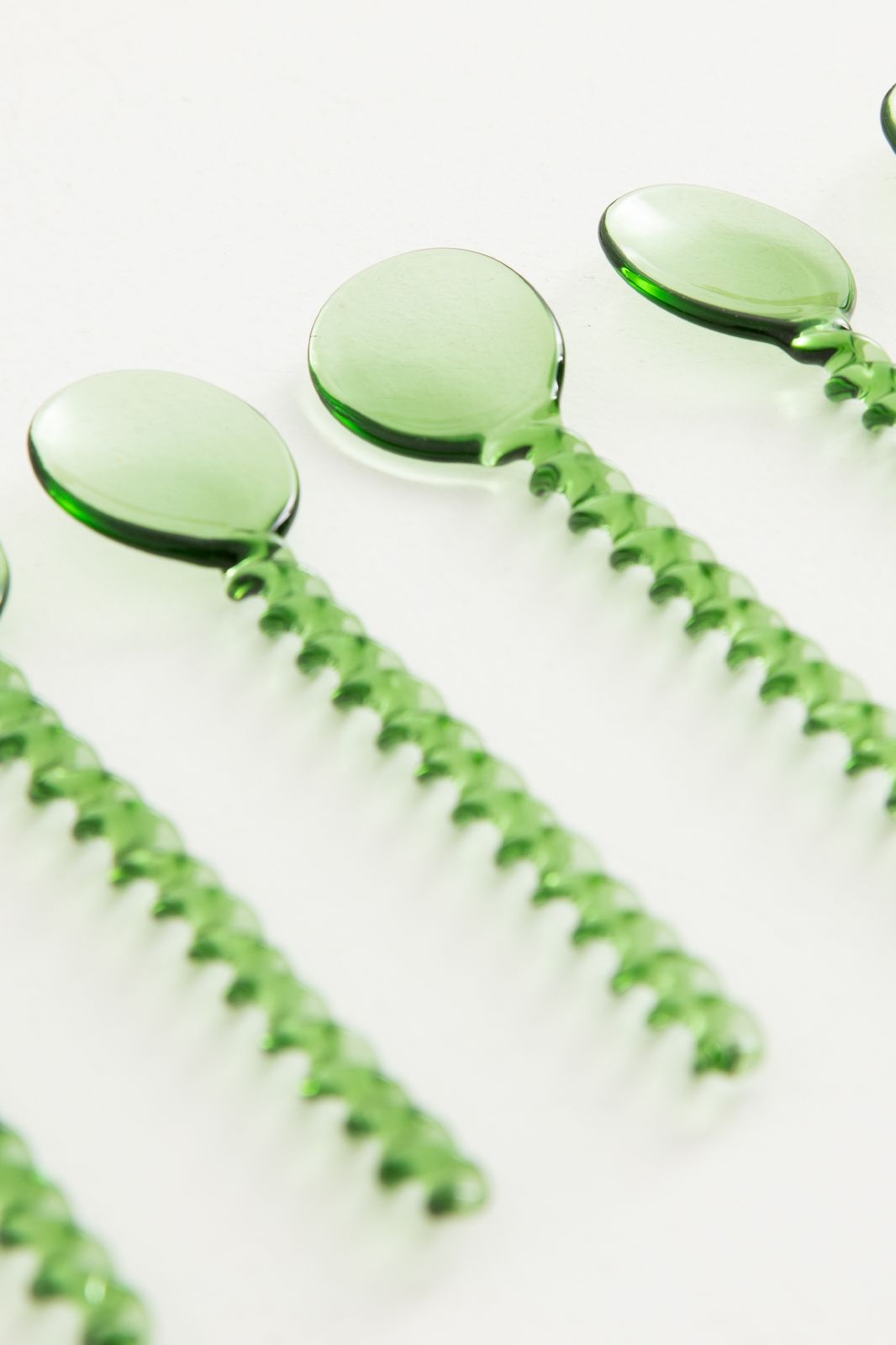 Groene glazen lepel twisted