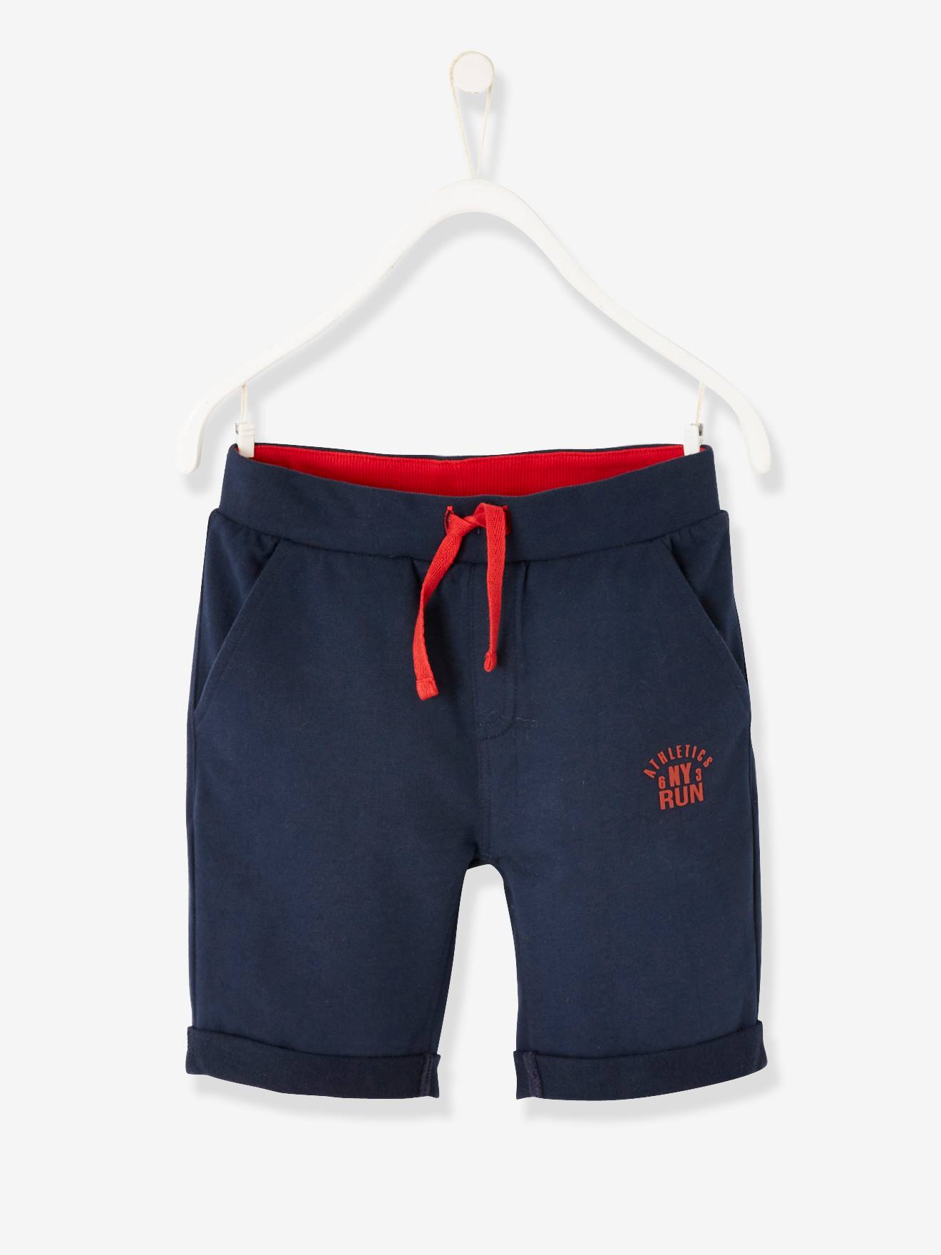 Calções desportivos lisos azul-escuros para meninos com estampas.