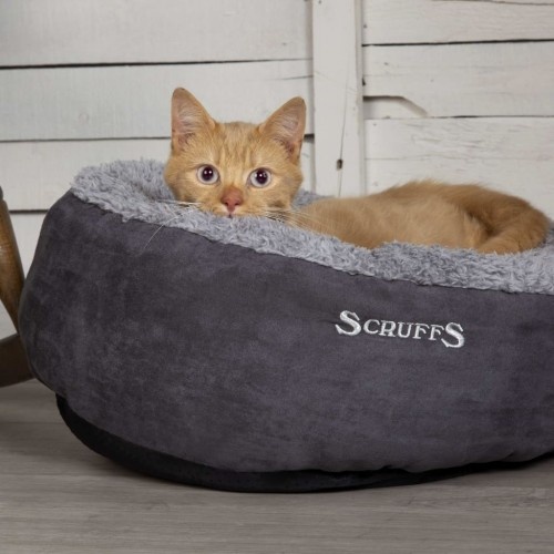 Cama cinza para animais de estimação com forro externo.