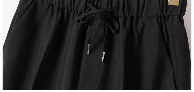 Loansk - Effen cropped, taps toelopende broek met trekkoord in de taille