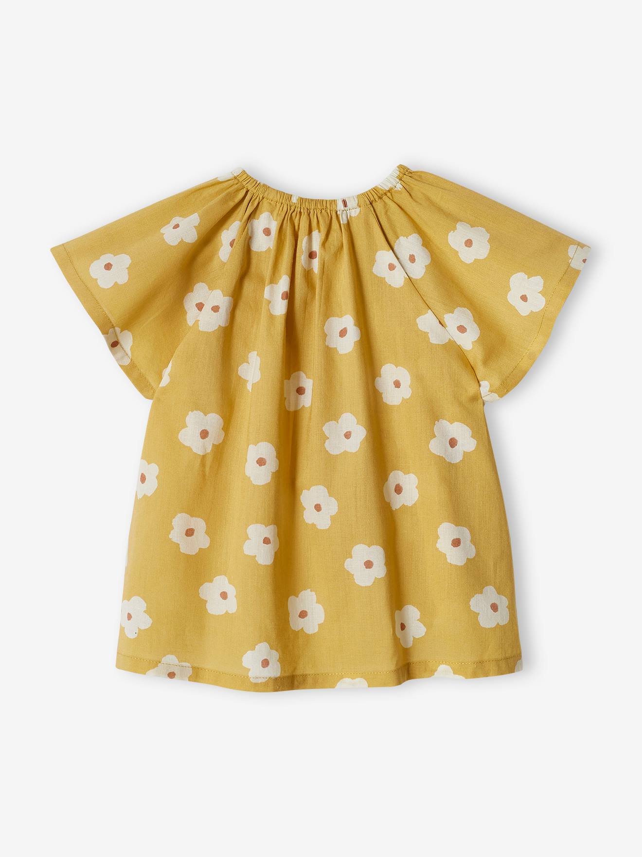 Blusa infantil amarelo-clara com mangas borboleta.