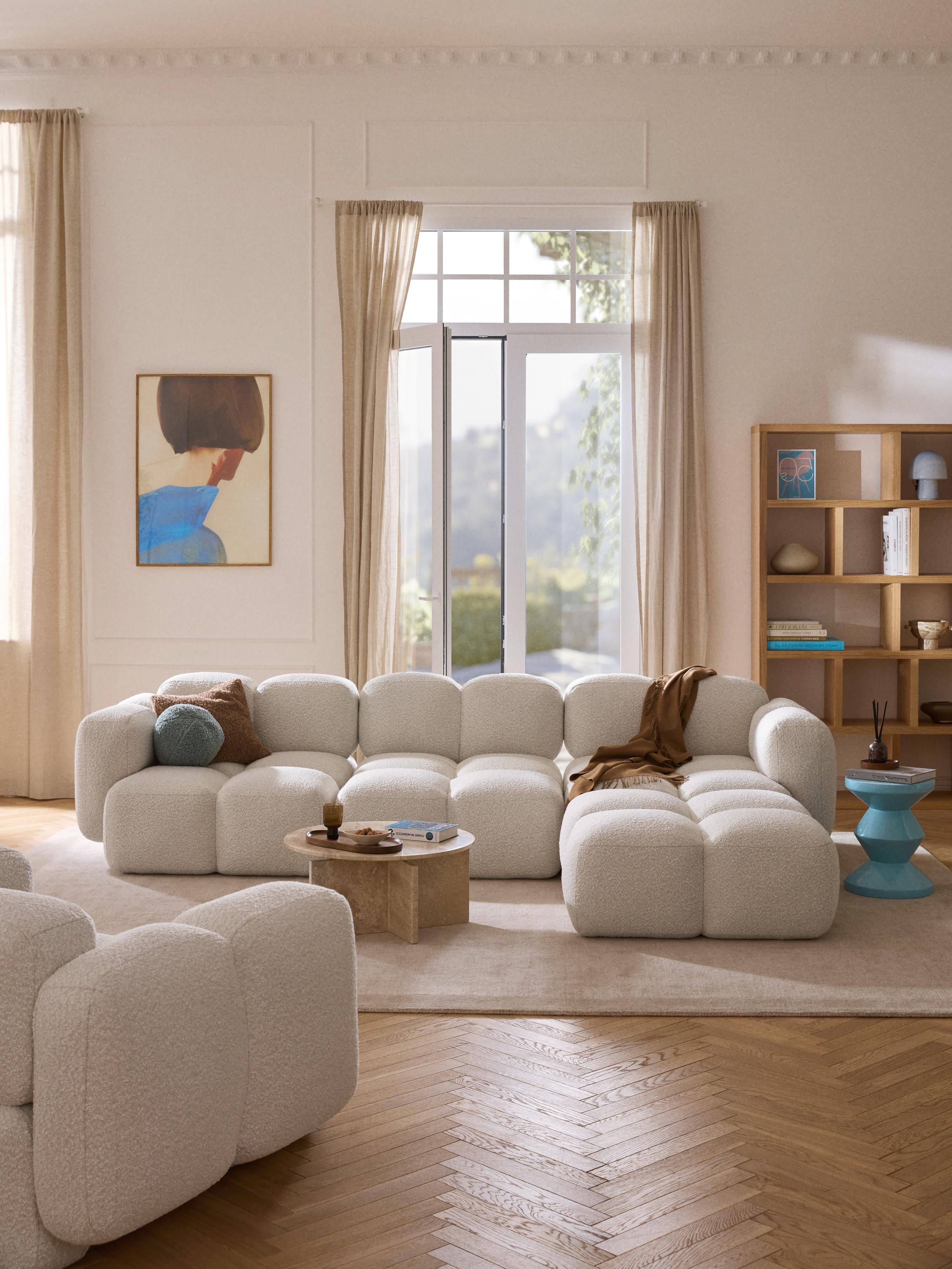 Modulaire bank Tayla (4-zits) van bouclé met poef (links/rechts)