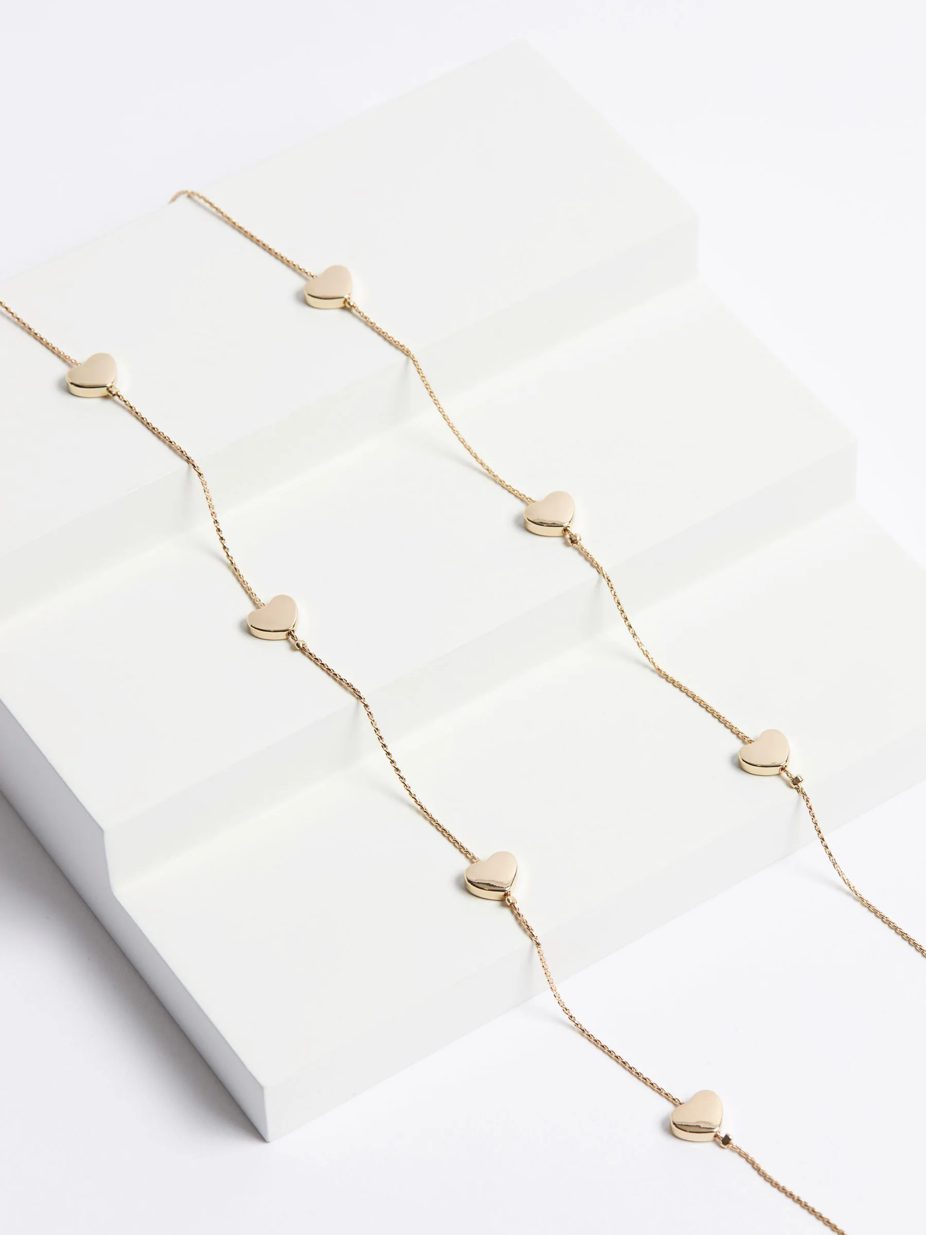 Goudkleurig - Lange draadketting met hartje