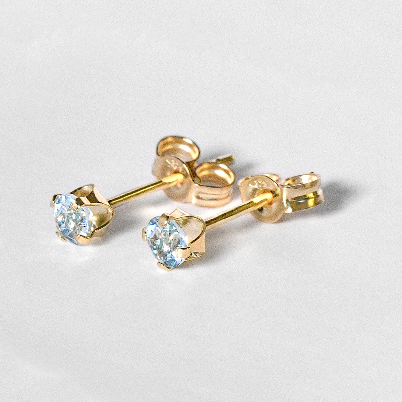 Instant d'Or Boucles d'oreilles Puces Topaze 0.17 ct or jaune