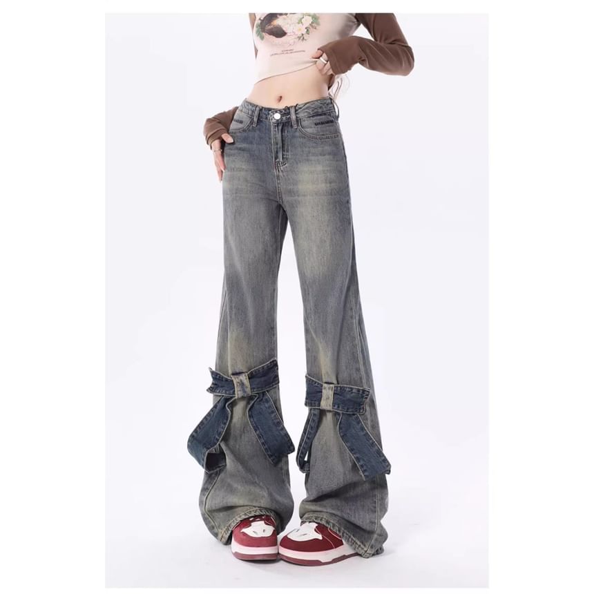 Jerolenea - Bootcut jeans met lage taille en strikaccent
