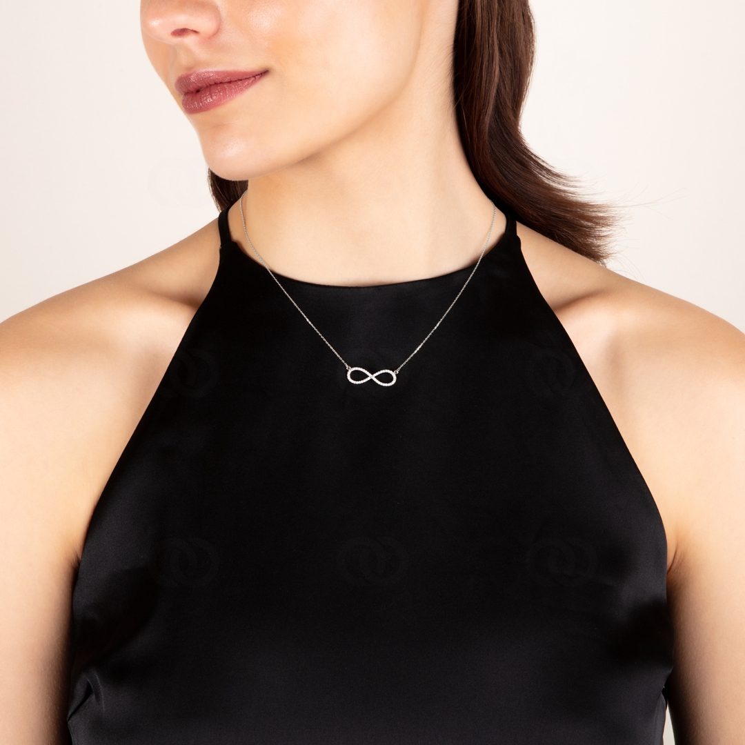 Collier mit Anhänger 750/18 K Weissgold Infinity mit Diamant 0.24 ct H/si