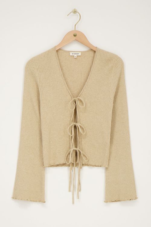 Beige vestje met lurex & strikjes
