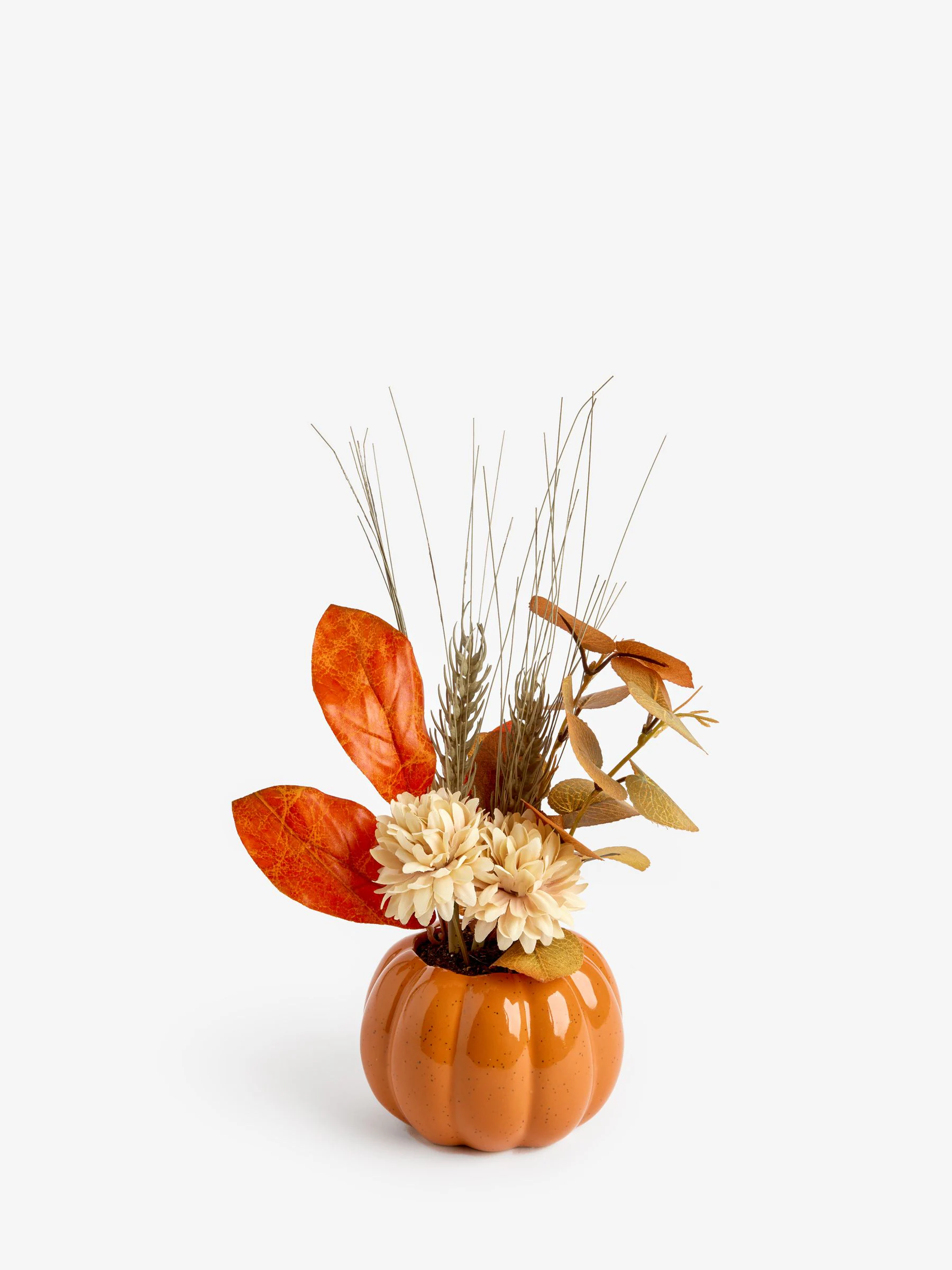 Kunstbloemenarrangement in pompoenpot