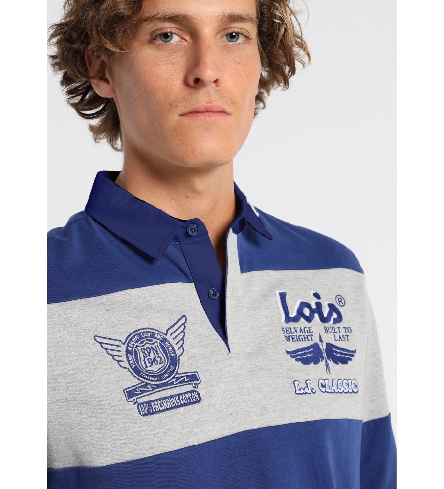 Polo Lois de manga comprida com listra no peito e estampa de selos azuis.