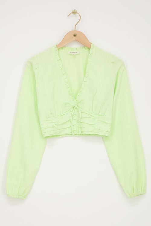 Groene crop top met ruffles en smock