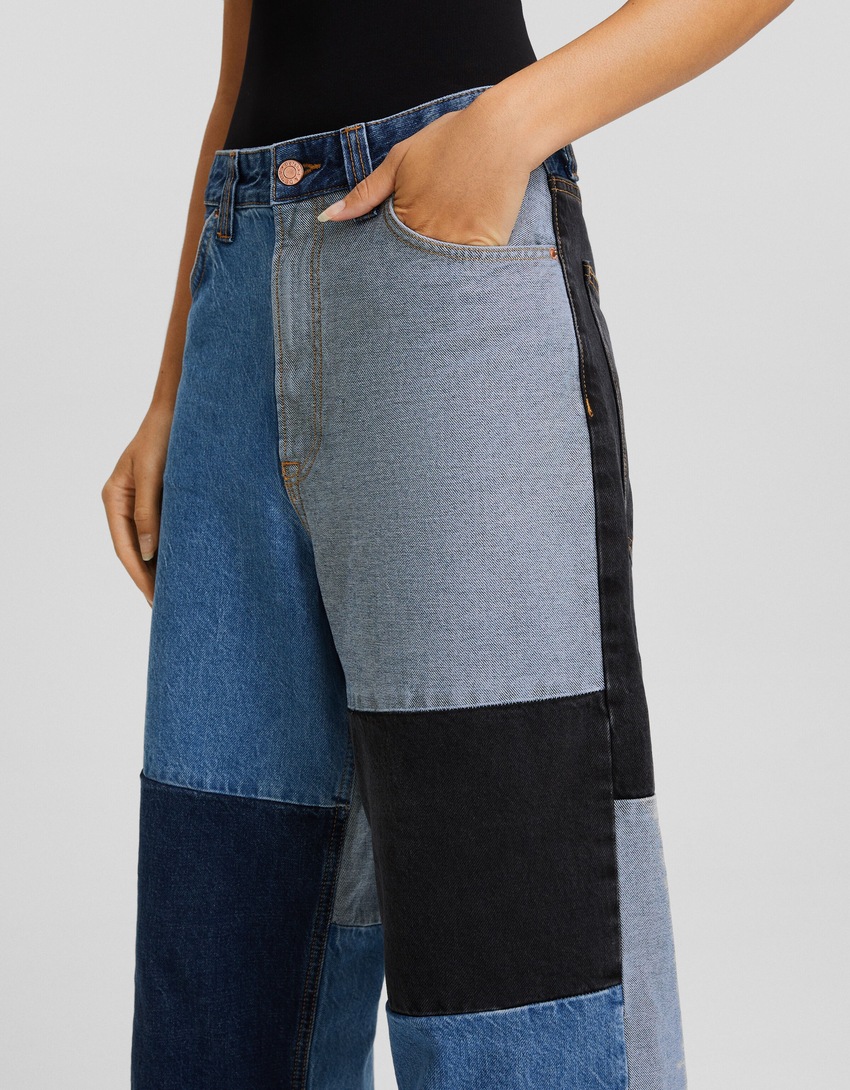 calças jeans super largas com blocos de cores