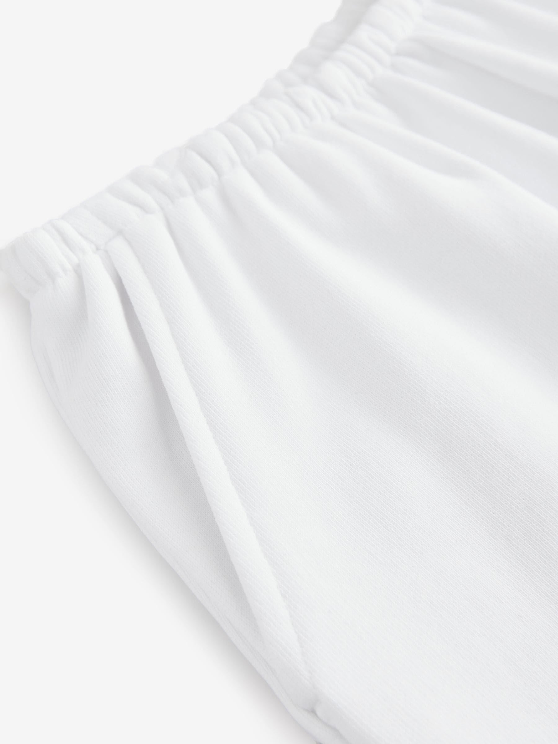 Ecru - Gewassen katoenen jersey shorts met ruwe zoomdetails