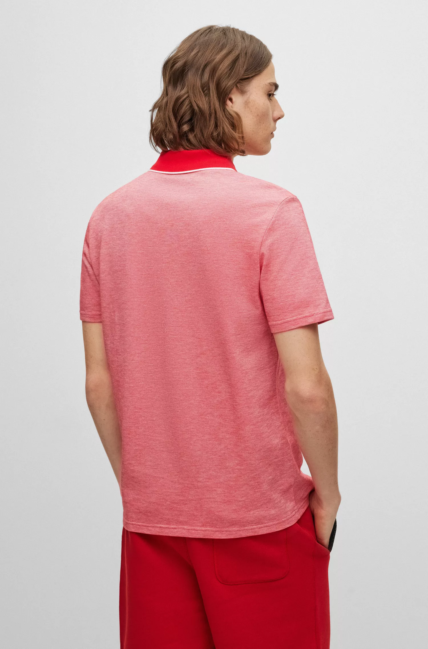 Camisa polo BOSS laranja em piqué de algodão com emblema da marca.