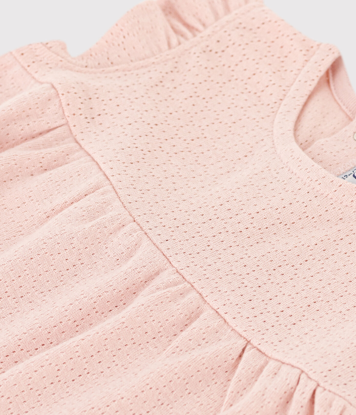 Blouse bébé sans manche en maille ajourée