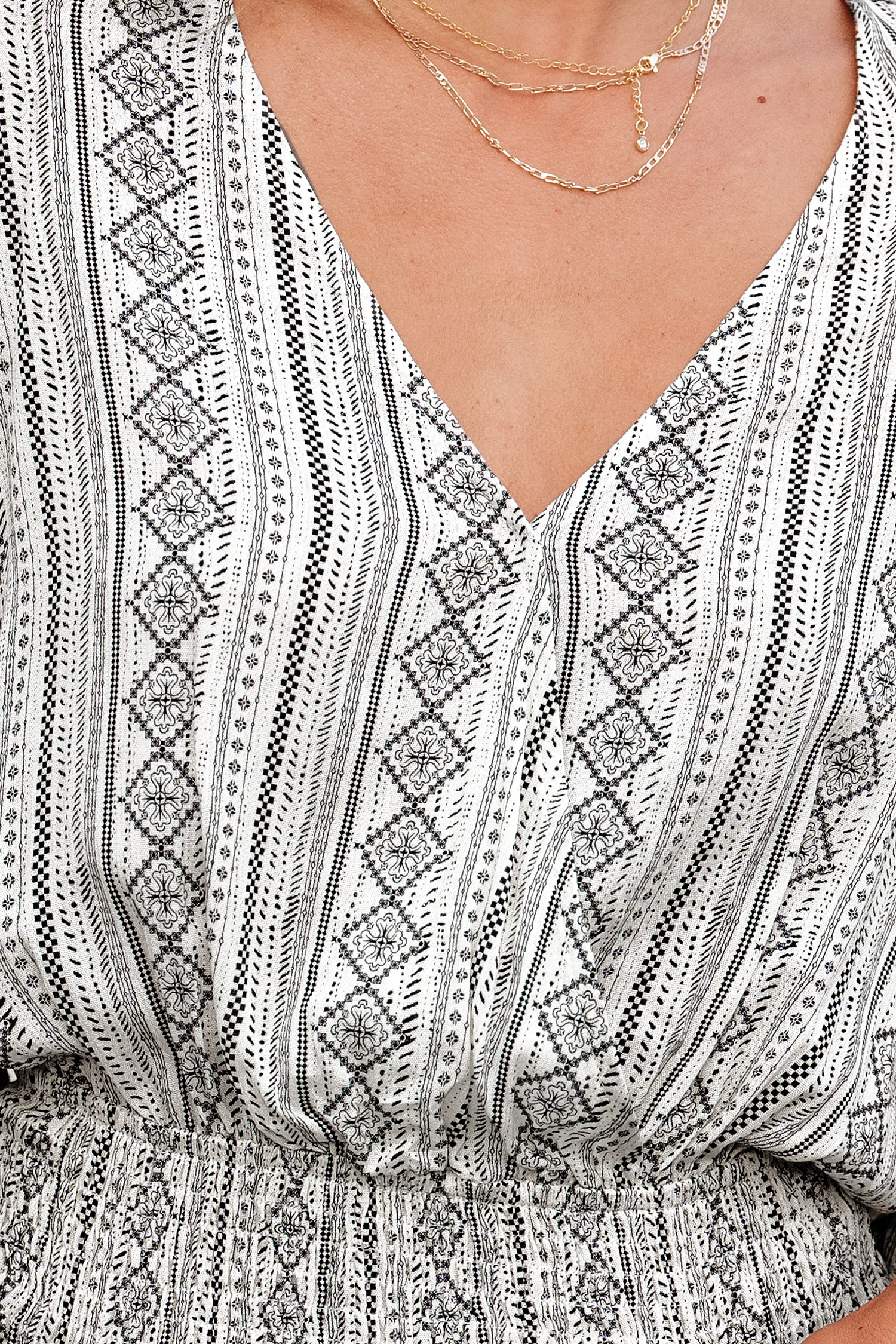 Haut avec manches dolman à smocks géométrique