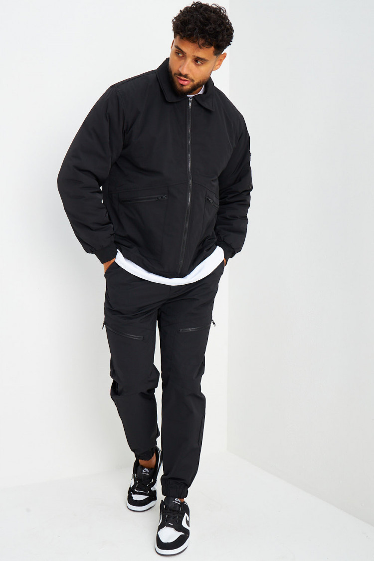 Blouson noir à poches zippées