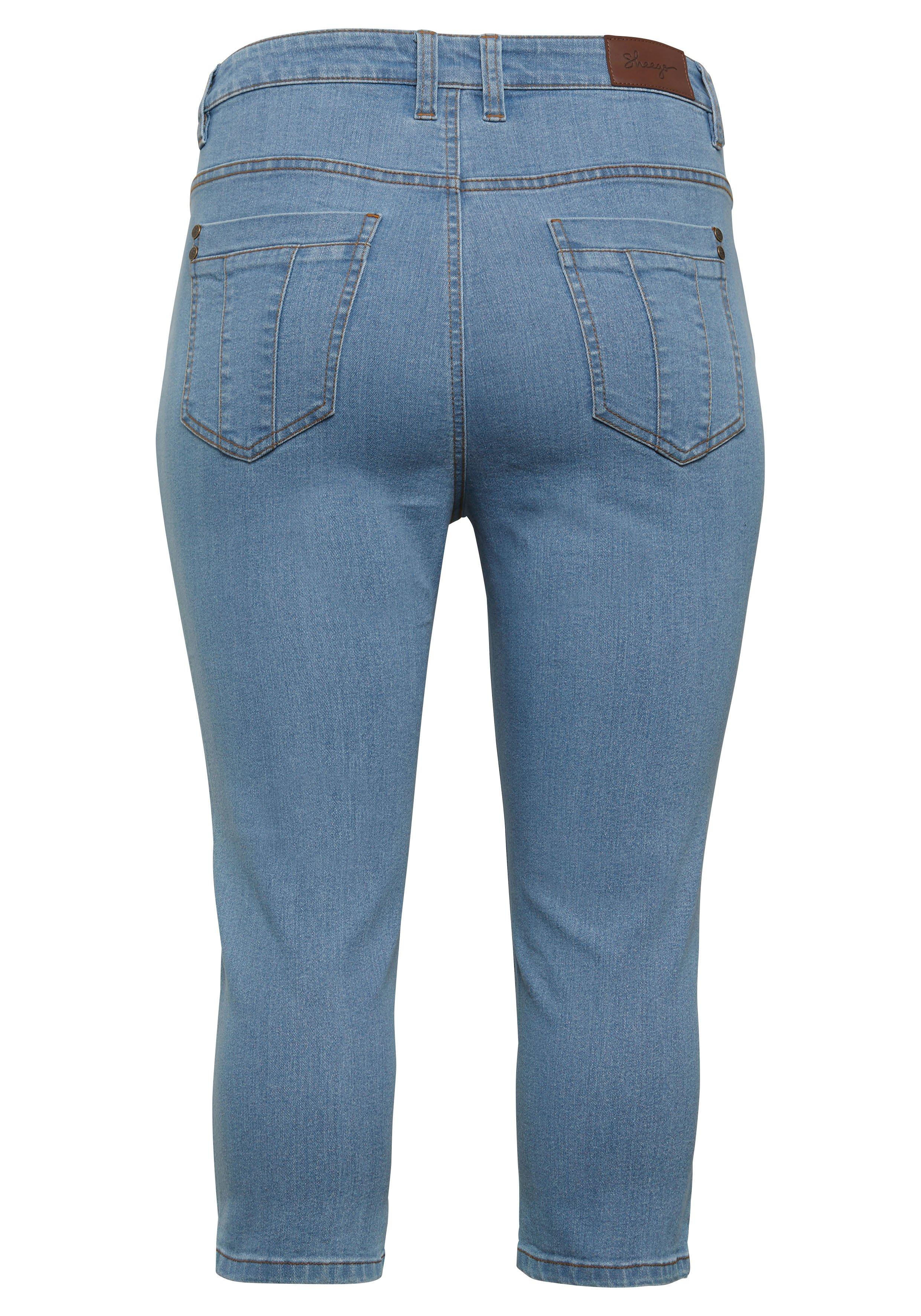 Caprijeans mit Catfaces und Kontrastnähten