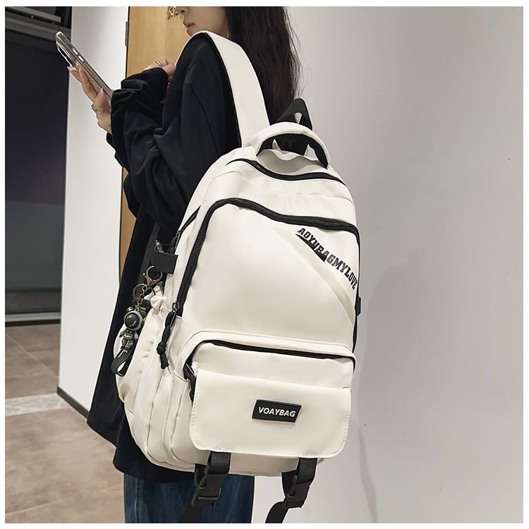 EAVALURE - Set: Rugzak van effen nylon met gesp en letters + tasbedel