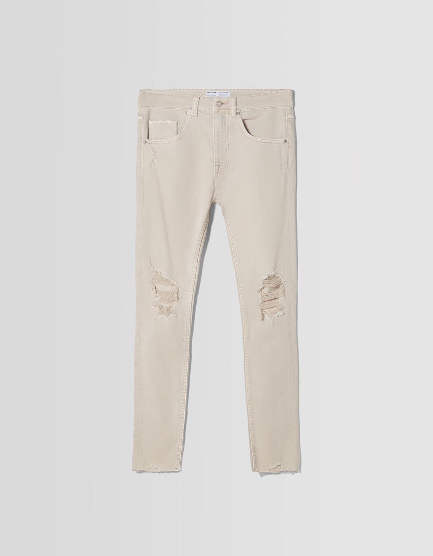 calça jeans super skinny rasgada