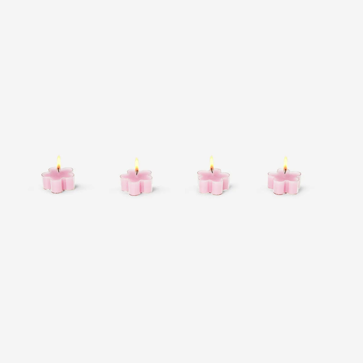 Lyserøde blomsterformede fyrfadslys - 4 stk