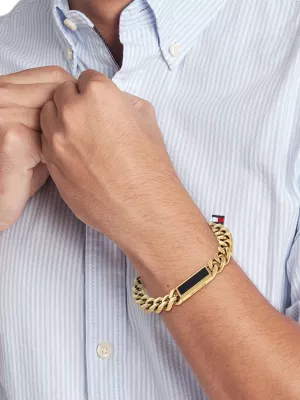 Pulseira com logotipo em ônix banhado a ouro