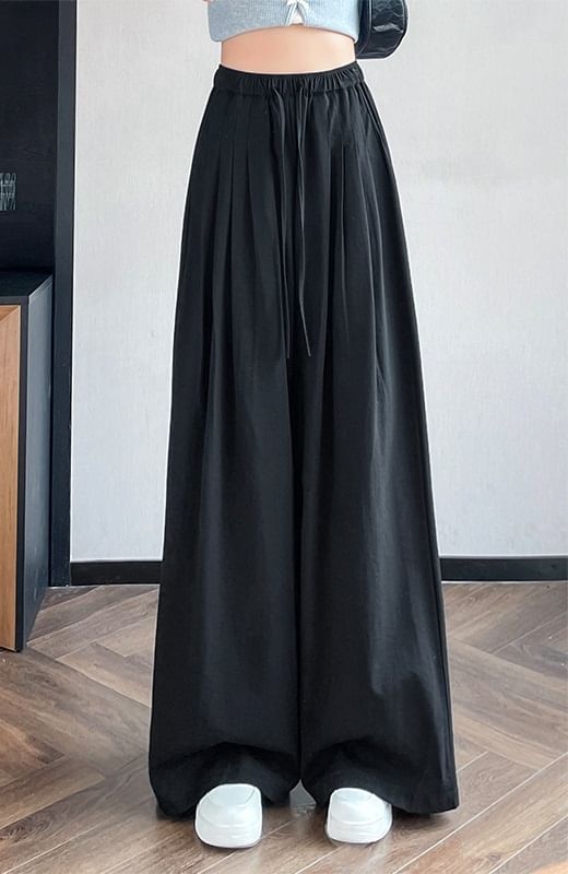 Tel tot 10 - Effen broek met wijde pijpen en trekkoord in de taille (verschillende ontwerpen)