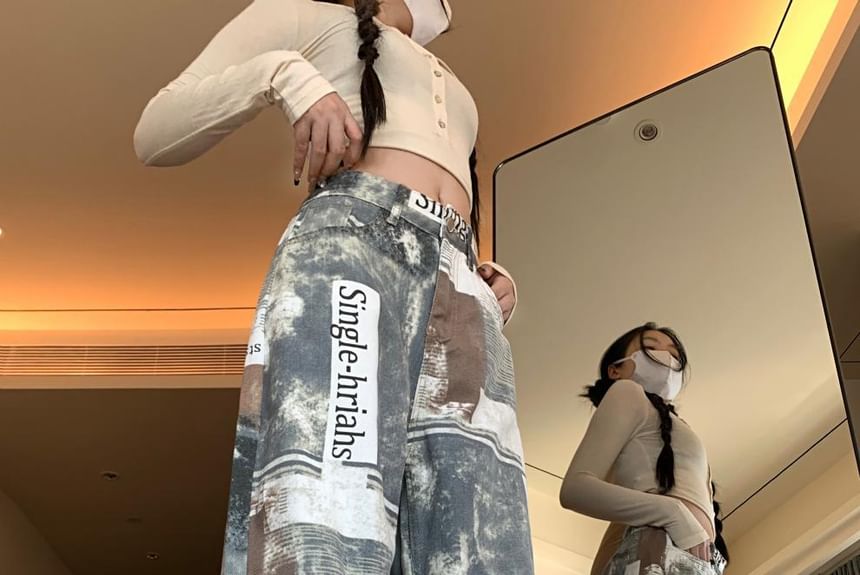 Chisan - Broek met hoge taille en wijde pijpen en krantenprint