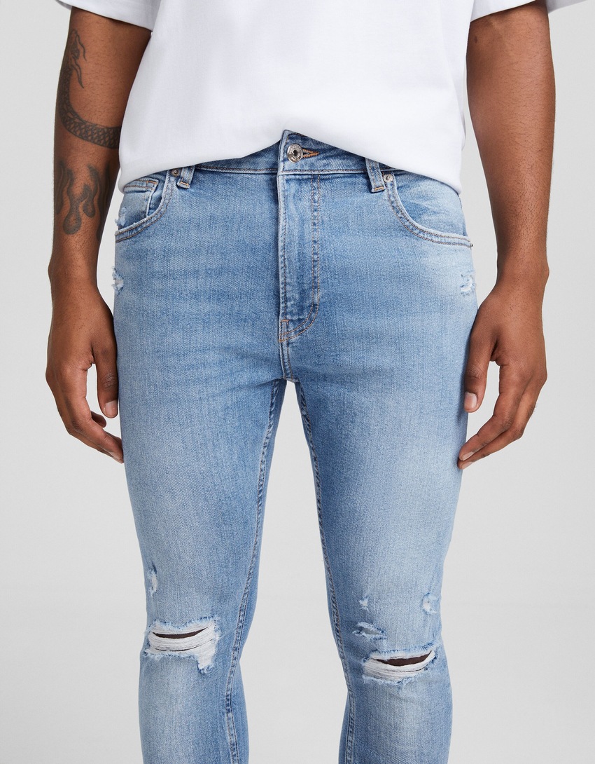Calça jeans skinny rasgada
