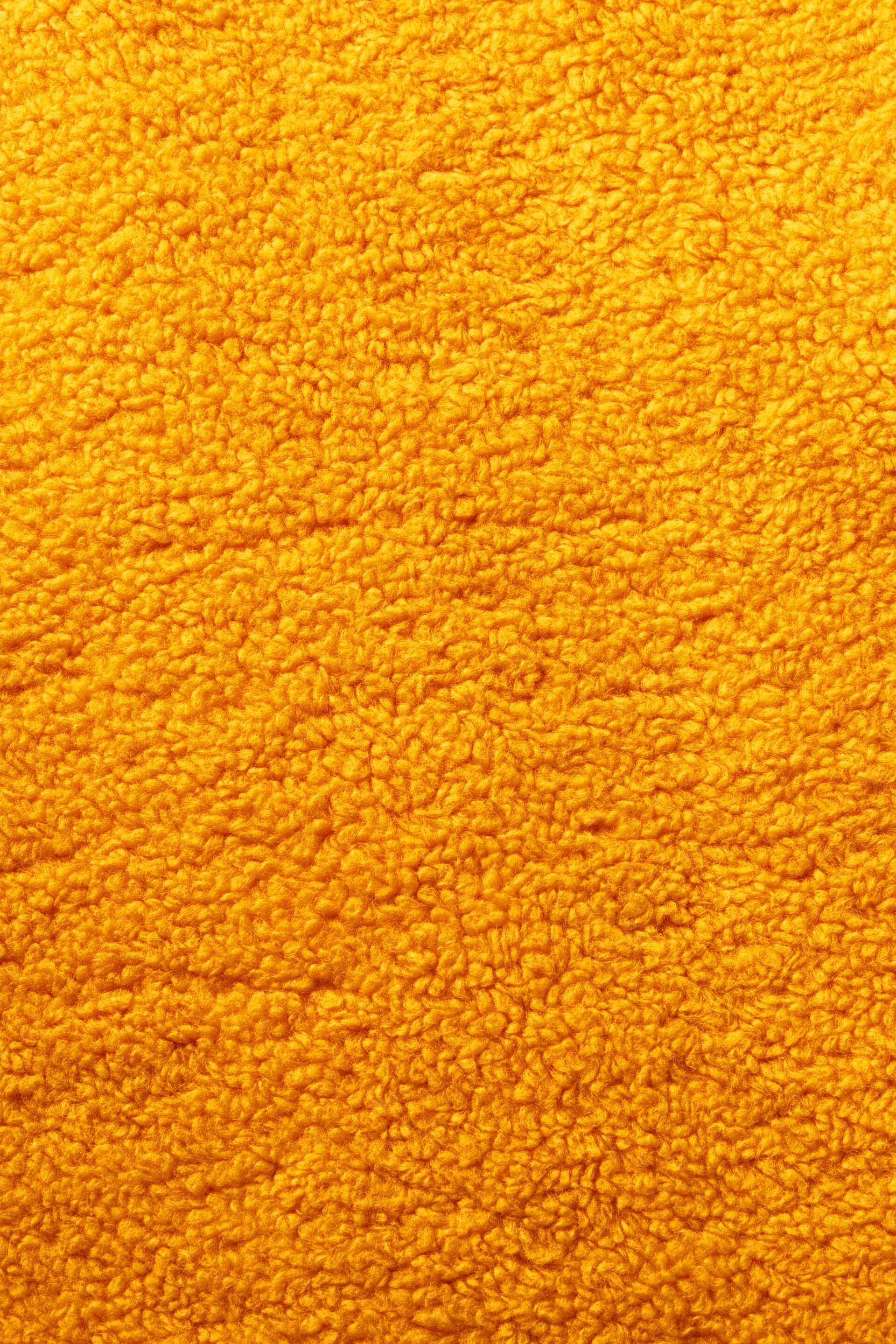 Veste sans manches en borgana d’aspect peluche ornée d’un logo brodé