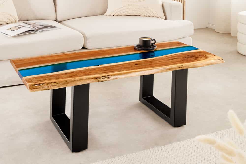 Massiver Couchtisch LIQUID 110cm braun Akazienholz Baumkante schwarz Eisen blau