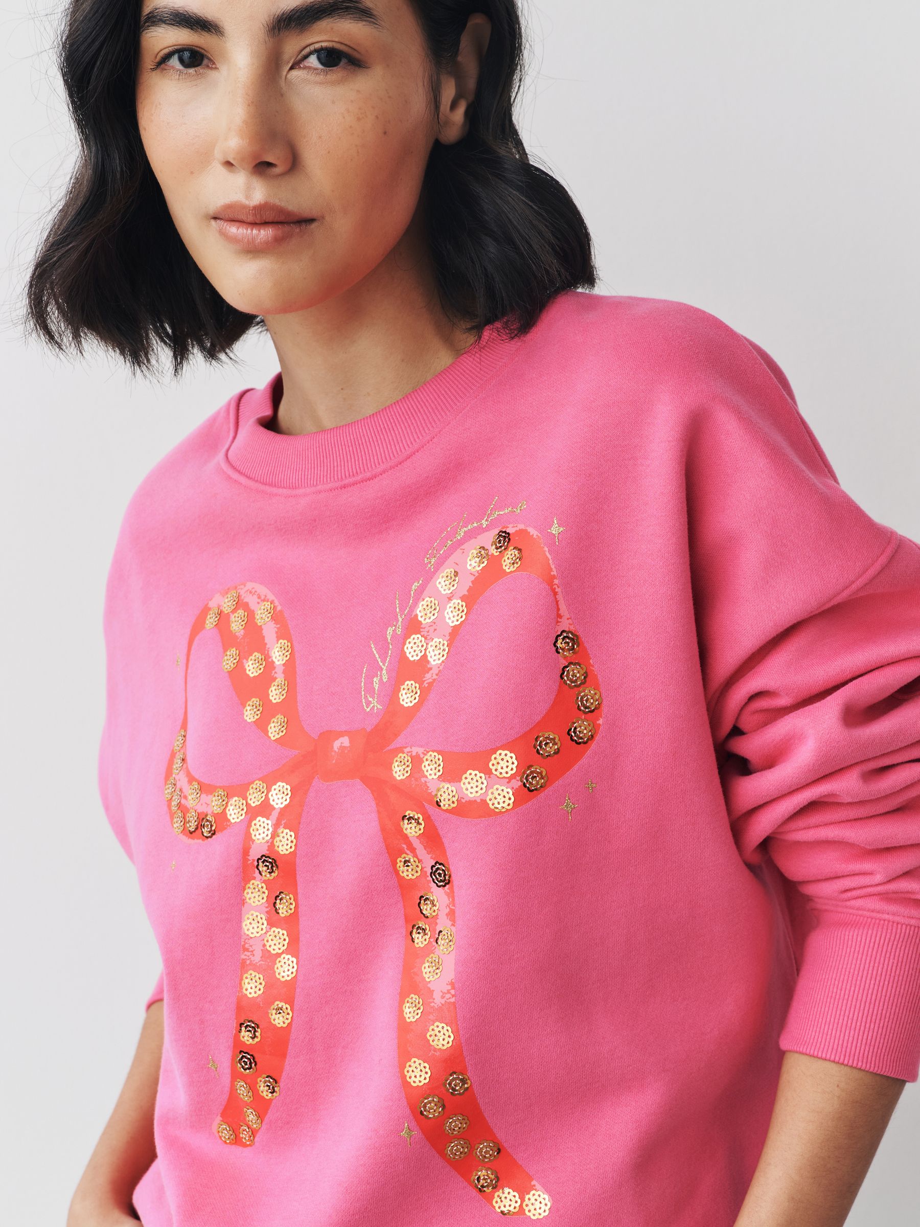 Bessenroze - Seasonal Christmas Bow Graphic With Sparkle Sequins Longsleeve Crewneck Sweatshirt