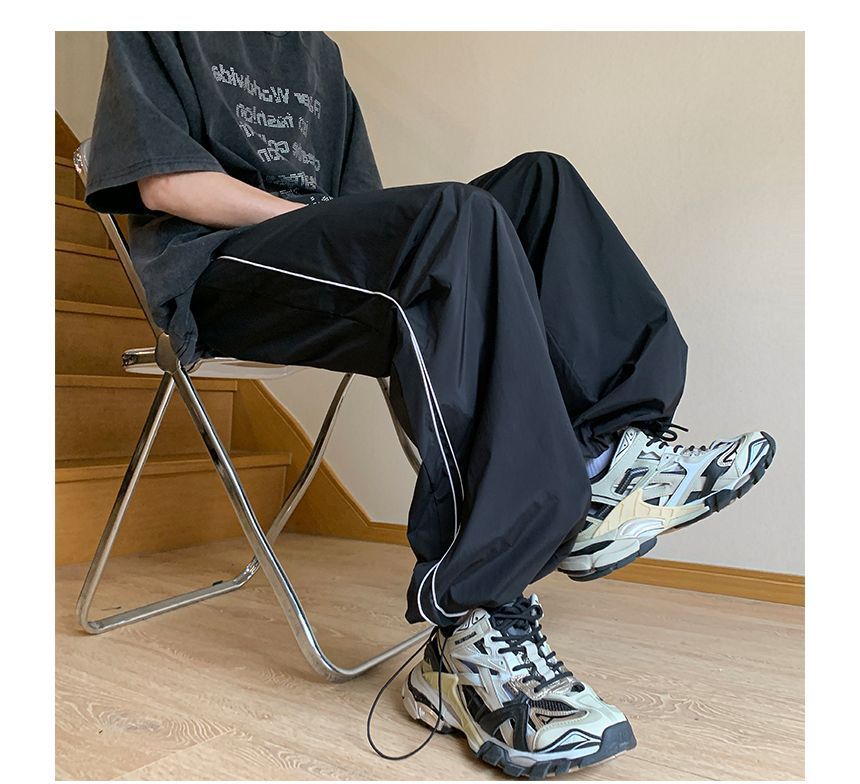 Posive - Gestreepte joggingbroek met wijde pijpen en trekkoordtaille