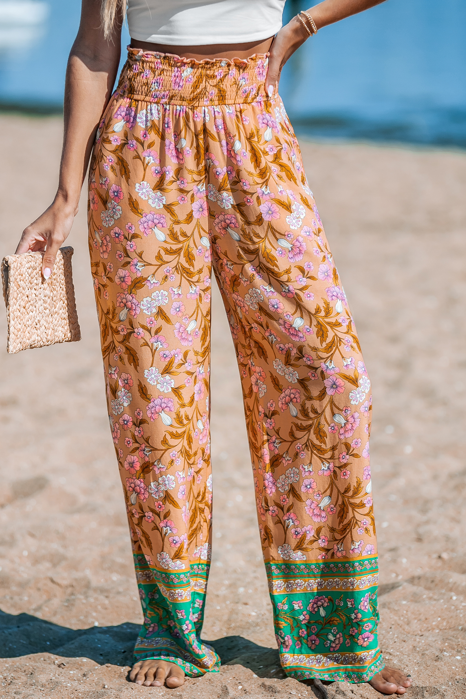 Pantalon fleuri avec jambes droites et taille à smocks orange