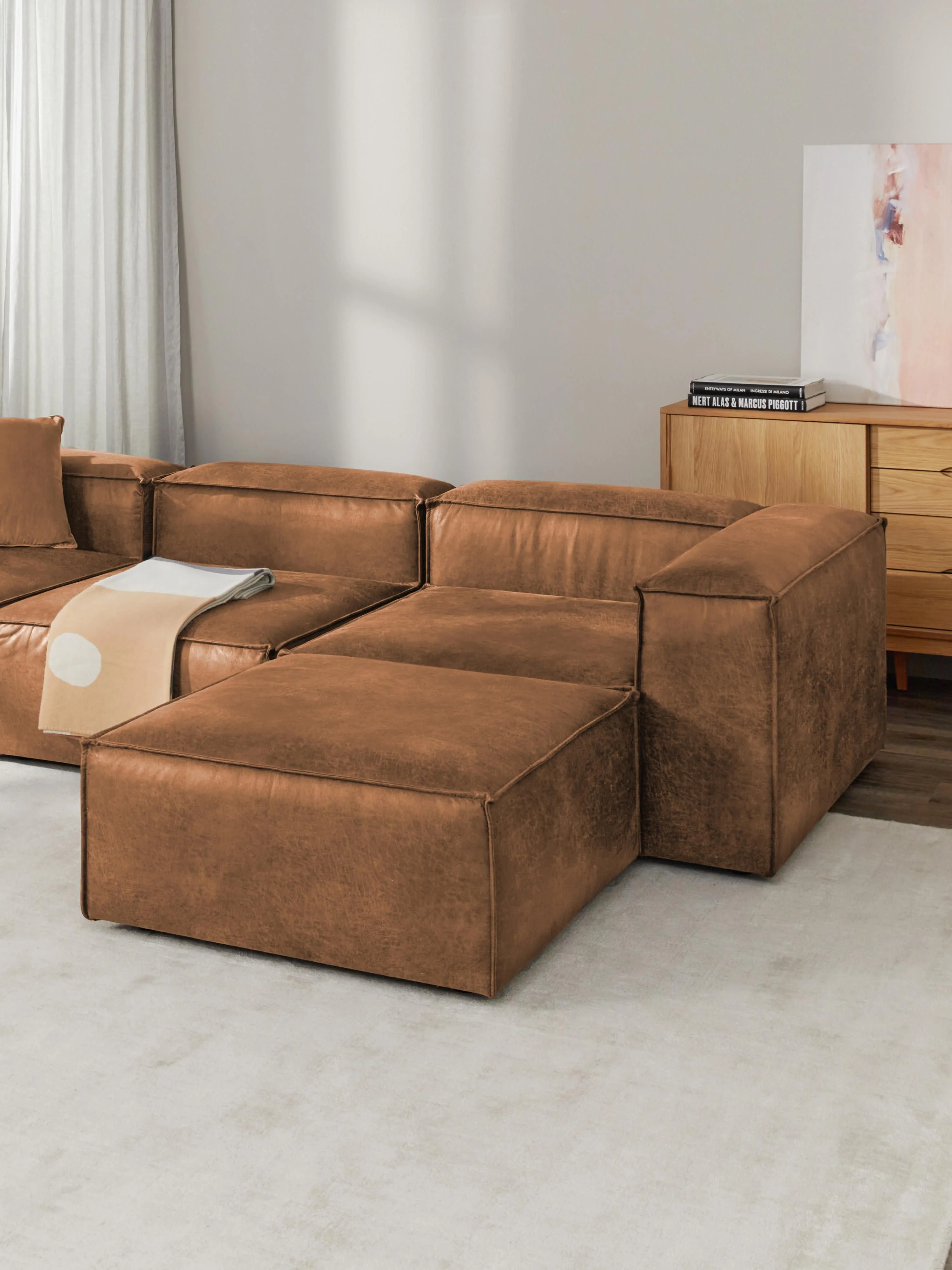 Modulaire bank Lennon (4-zits) van gerecycled leer met poef (links/rechts)