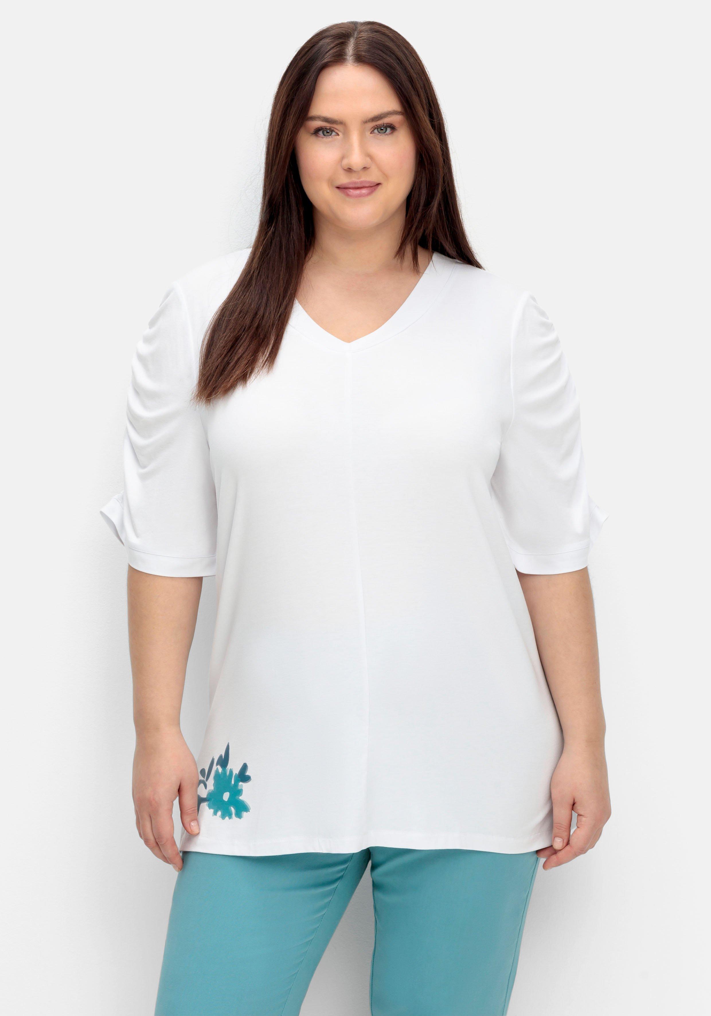 Shirt mit Blütenprint am Saum