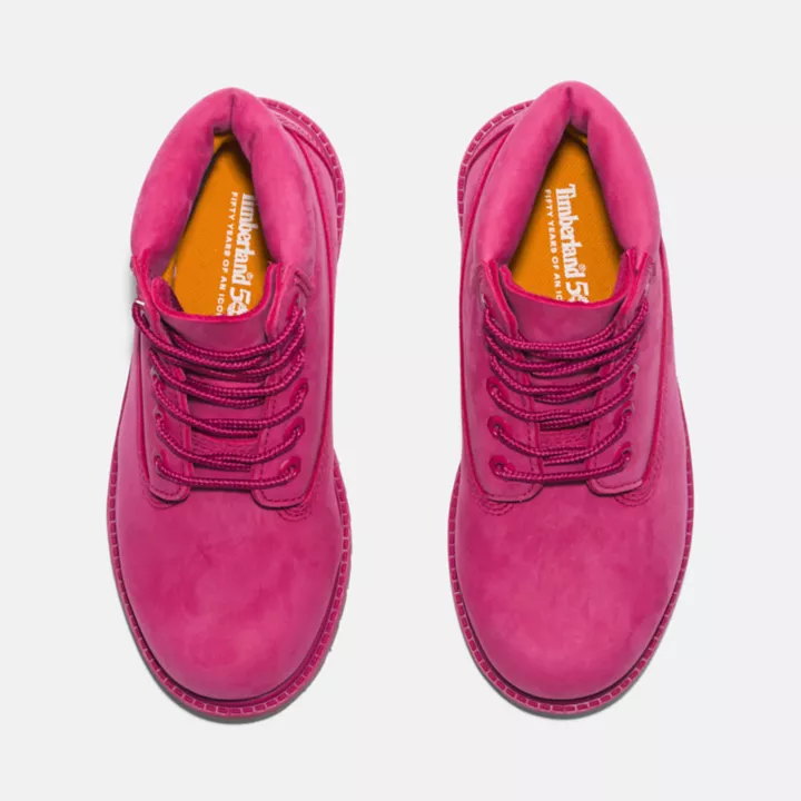 Bota Timberland Premium de 6 polegadas impermeável, edição 50, para jovens, na cor rosa escuro.