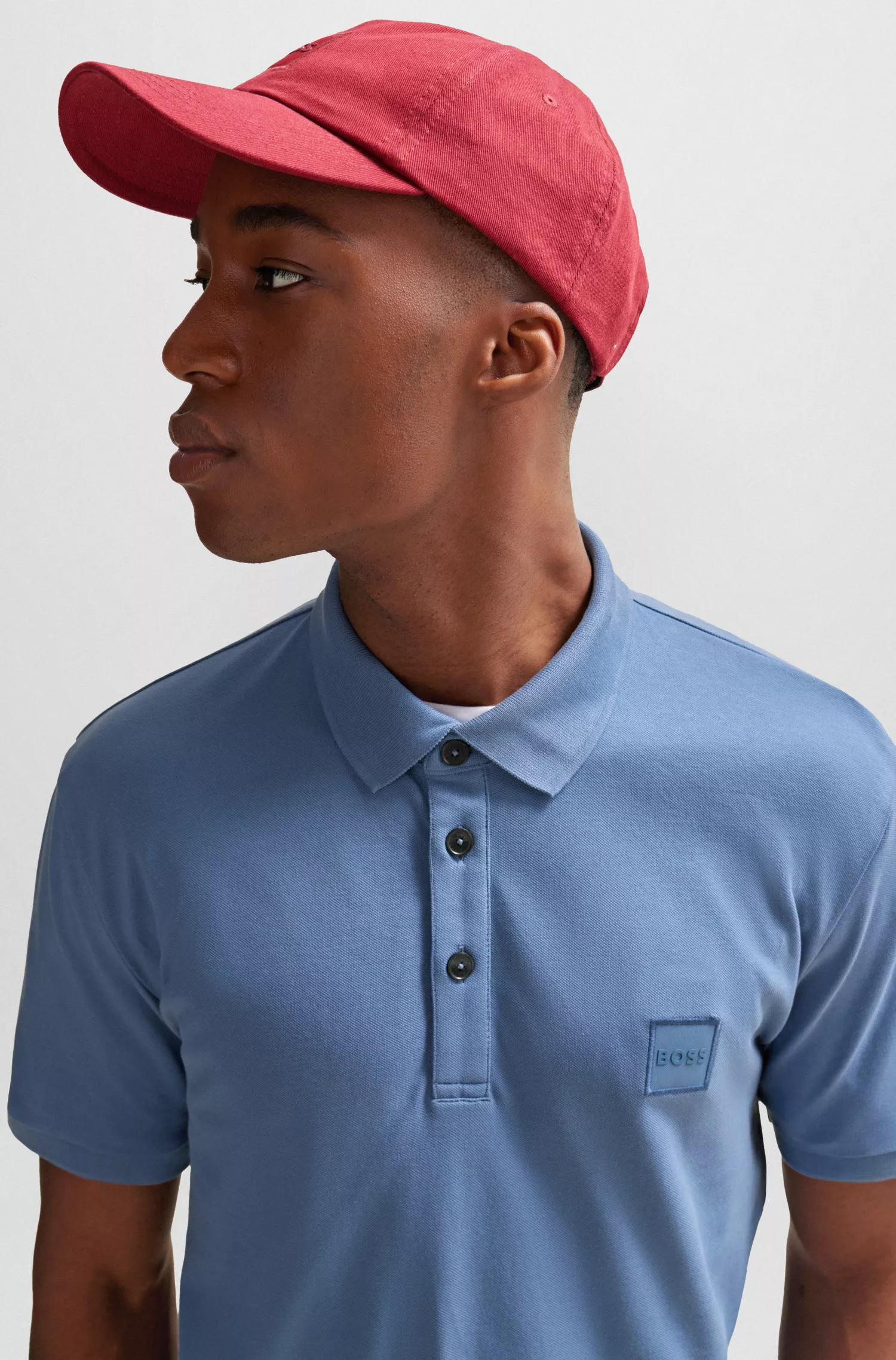 Camisa polo BOSS laranja, de algodão stretch, corte slim, com etiqueta de logotipo.