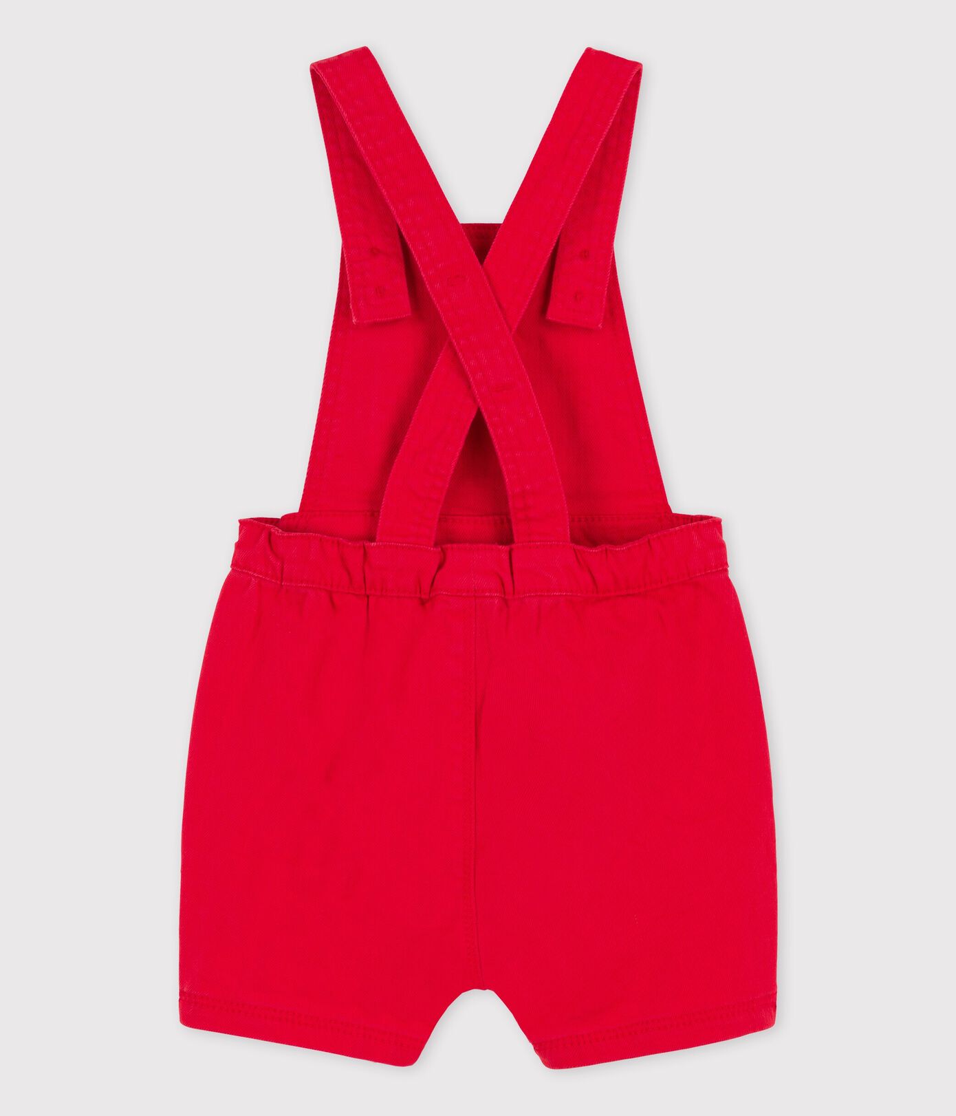 Salopette courte en denim coloré bébé