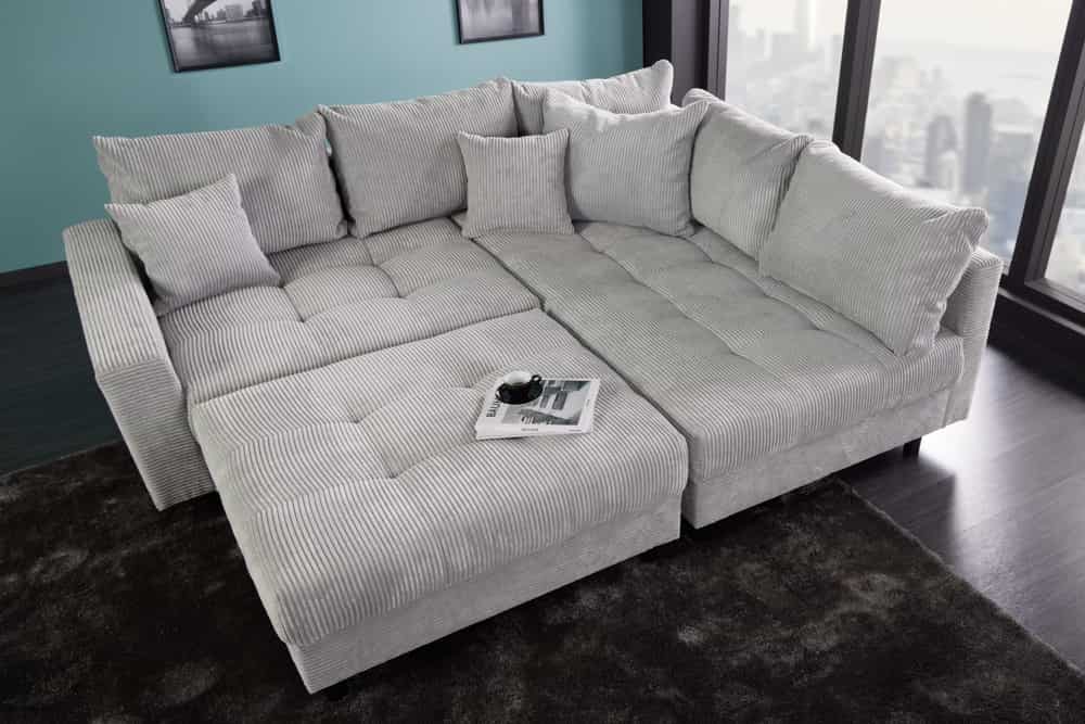 Modernes Ecksofa KENT 220cm hellgrau Cord inkl. Hocker Federkern L-Form Wohnlandschaft