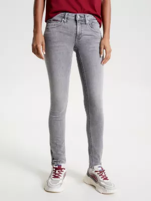 Calça jeans Scarlett de cintura baixa, corte skinny e zíper no tornozelo.