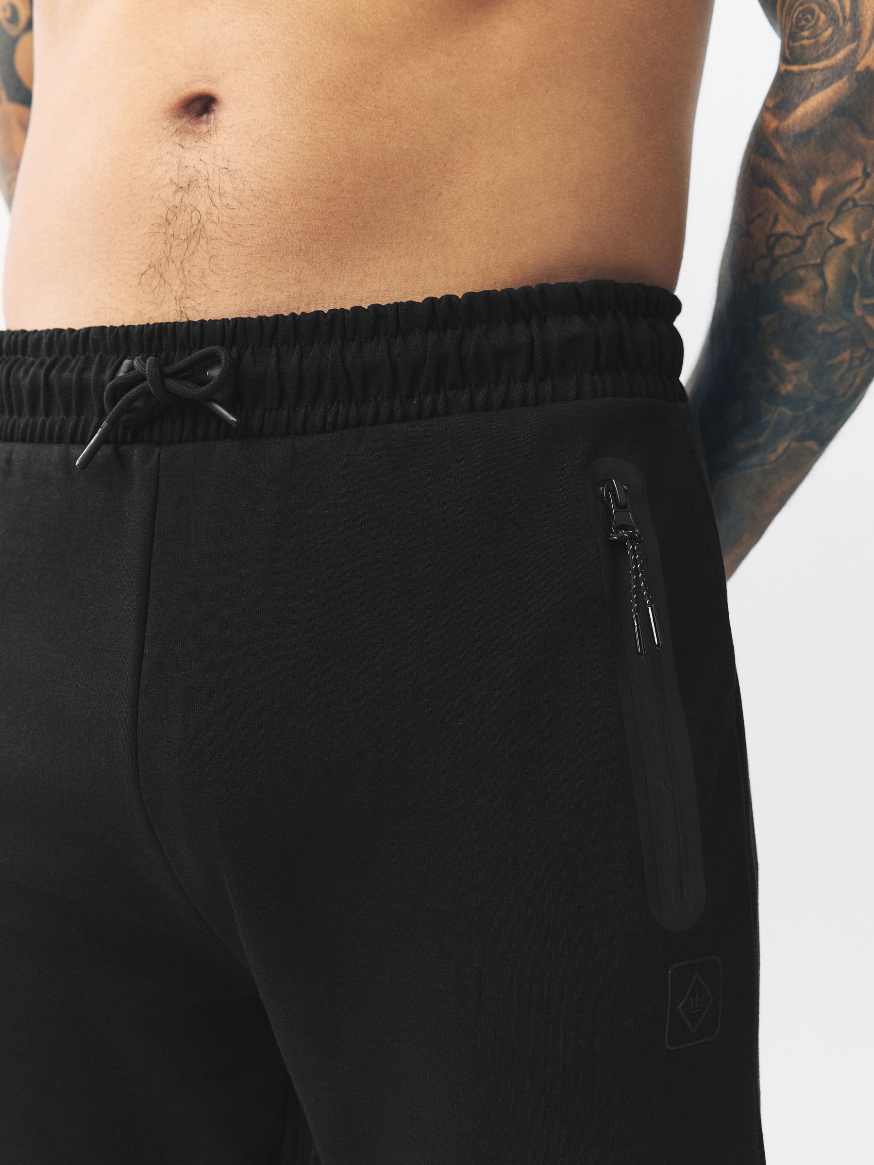 Zwart - Sport- en vrijetijdsjoggingbroek met boorden