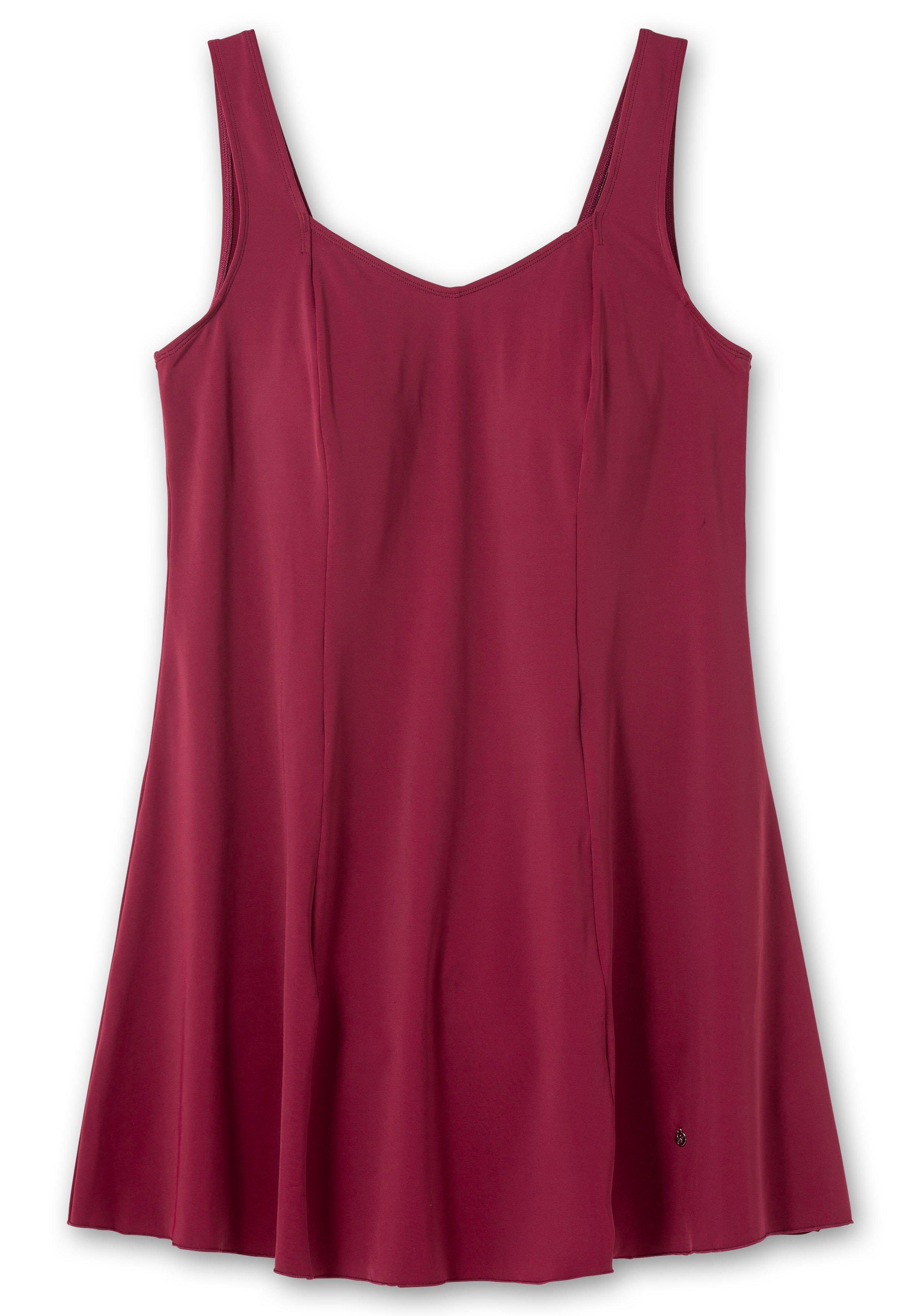 Badekleid mit V-Ausschnitt und integrierter Hose.