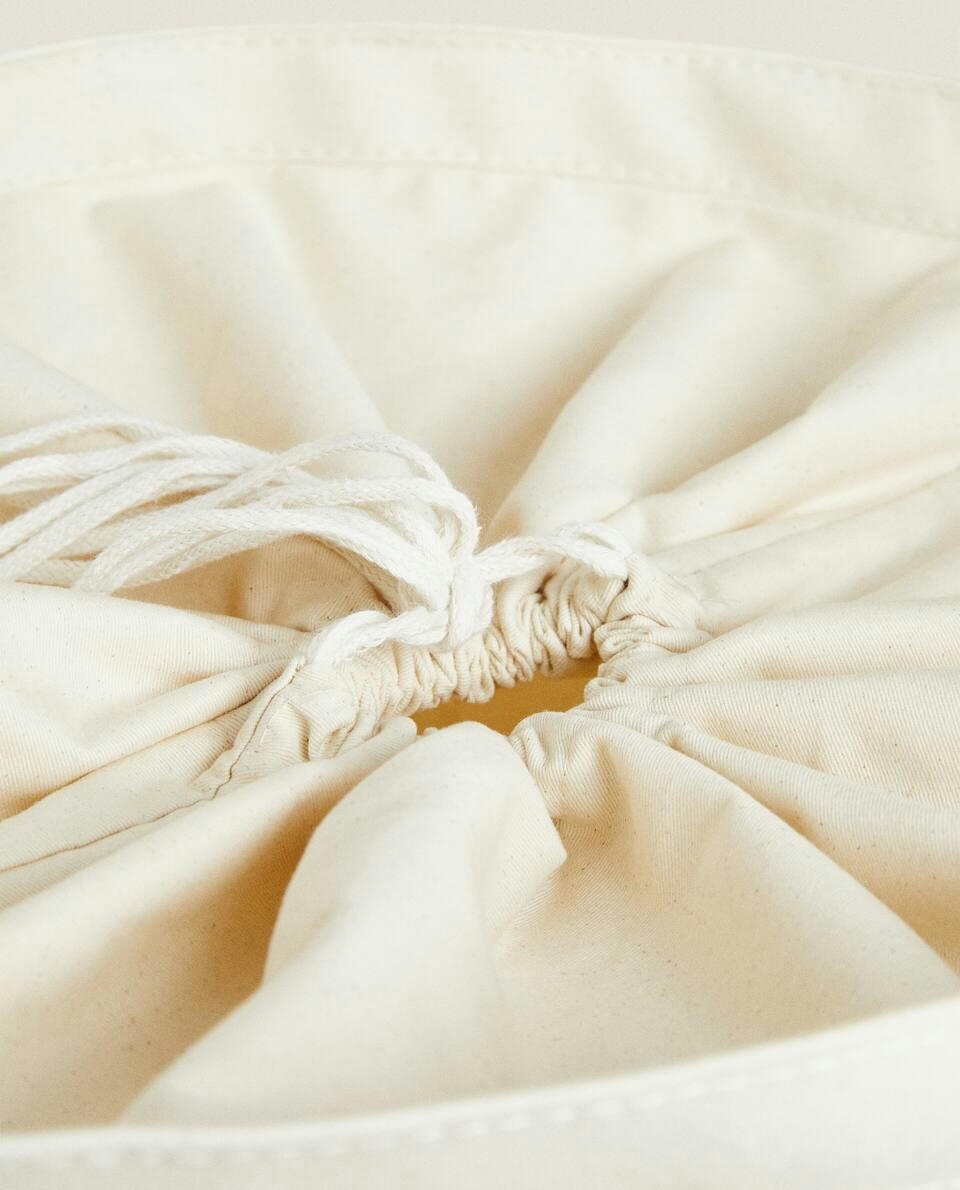 Cesto de roupa redondo com alças