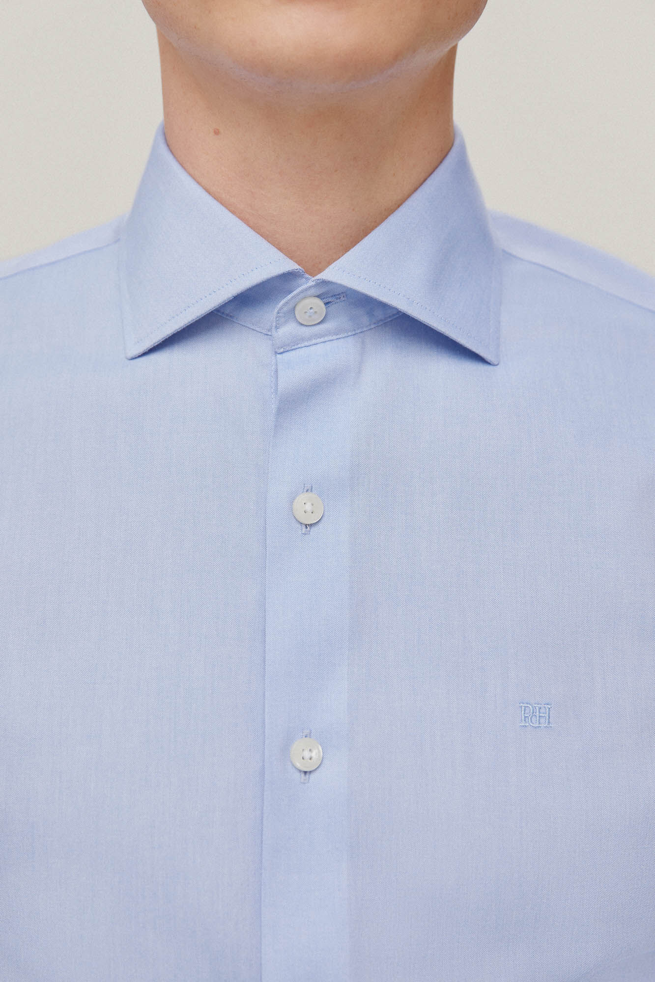 Camisa social lisa com detalhes em ponto ajour, não precisa passar e é resistente a manchas - Azul
