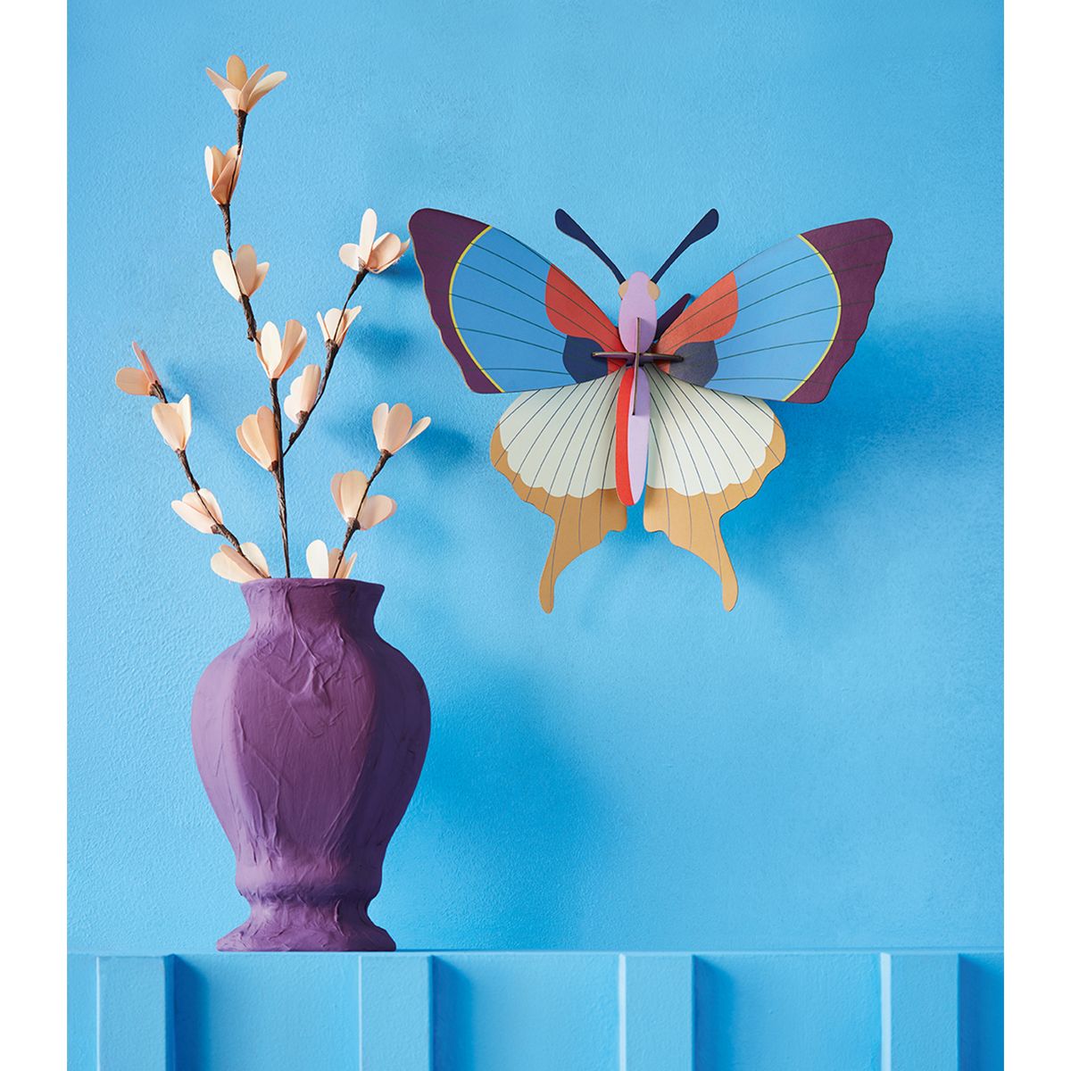 Trophée papillon à franges prune Studio Roof