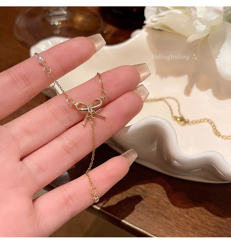 LIVSIA - Ketting met strik en nepparels