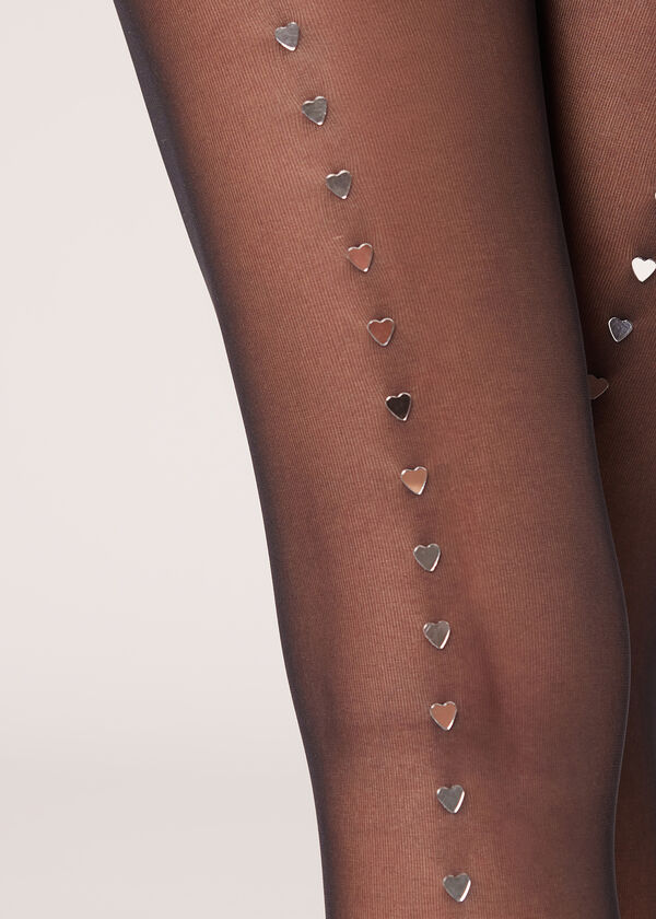 Meia-calça transparente 30 denier com costura traseira em formato de joia.