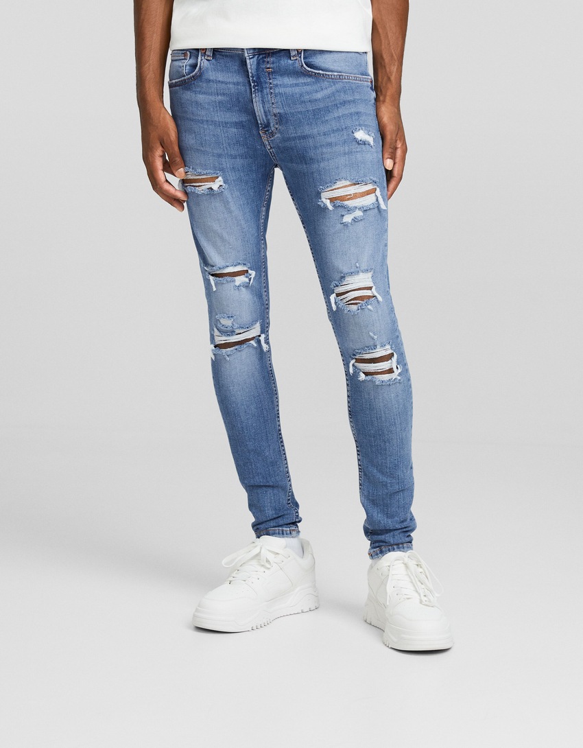 calça jeans super skinny rasgada