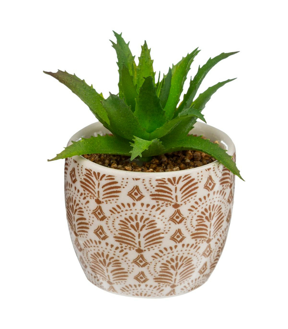 Plante artificielle verte dans un pot en céramique