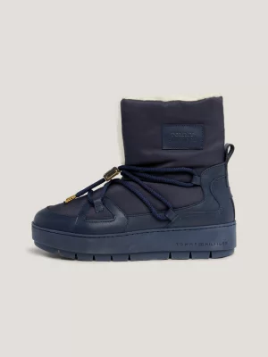Botas de neve essenciais com forro quente e travas.